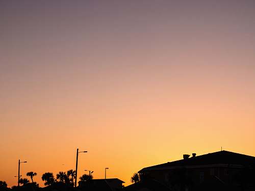 nature silhouette of house and trees during sunset outdoors