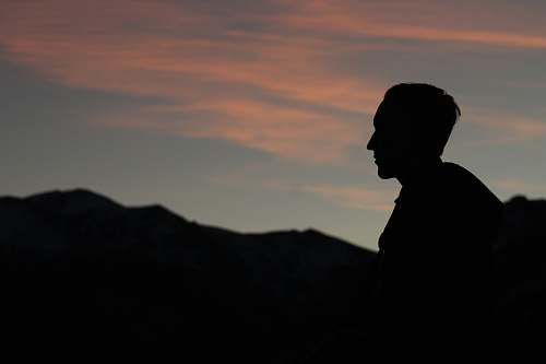 grey silhouette of man during twilight estes park