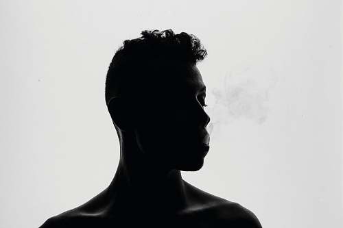 black-and-white silhouette of man smoking black