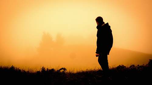 human silhouette of man standing open field people