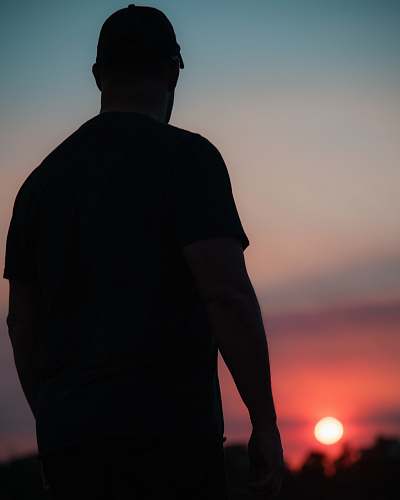 nature silhouette of man wearing shirt outdoors