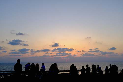 nature silhouette of people facing ocean outdoors