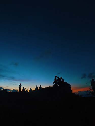 nature silhouette of people under blue sky outdoors
