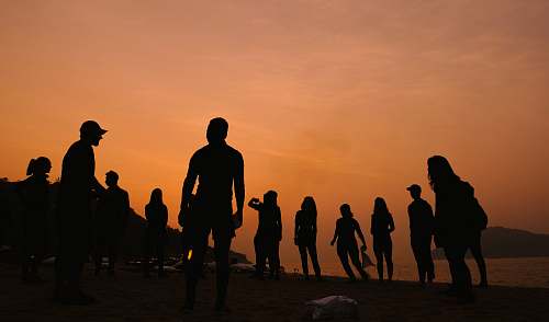 person silhouette of people under cloudy sky people