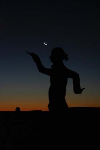 nature silhouette of person doing poses during golden hour outdoors