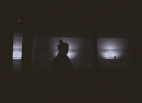 grey silhouette of person in room scary