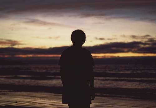 person silhouette of person near ocean human