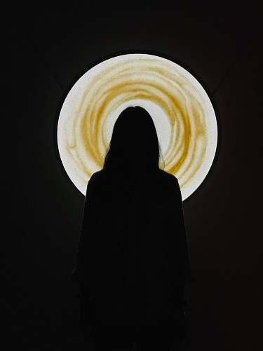 human silhouette of person standing and facing back person