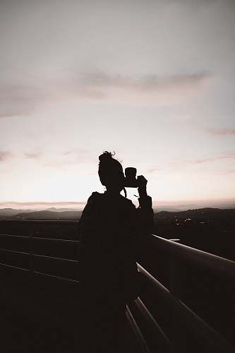 athens silhouette of person standing and holding camera greece