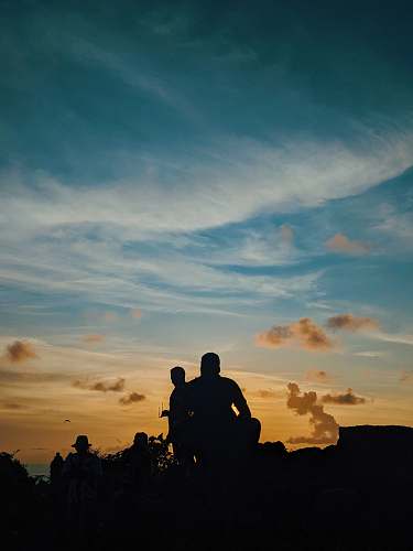 outdoors silhouette of sitting man nature