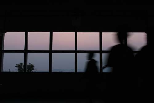 window silhouette of standing near window unika soegijapranata semarang