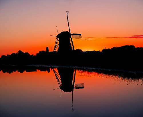 dusk silhouette of water mill netherlands