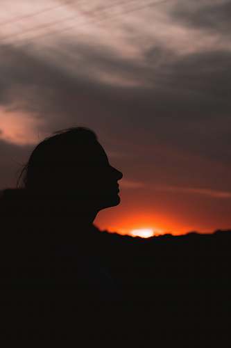 nature silhouette of woman during golden hour outdoors