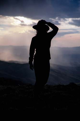 apparel silhouette of woman near mountains clothing