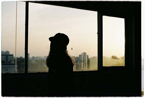 apparel silhouette of woman near window clothing