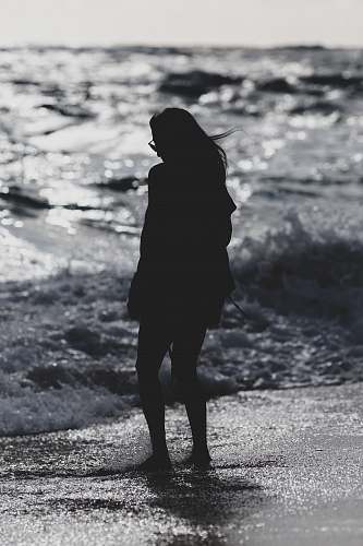 standing silhouette of woman standing on seashore person