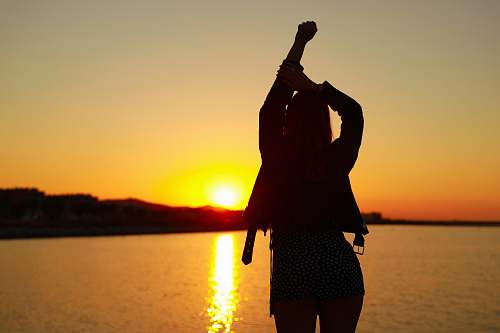 apparel silhouette of woman standing on shore clothing