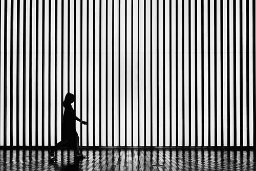 black-and-white silhouette on walking woman tokyo