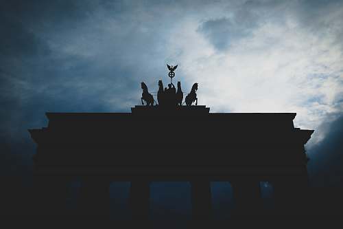 berlin silhouette photo of arc gate cloud