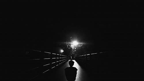 black-and-white silhouette photo of child standing on bridge navi mumbai