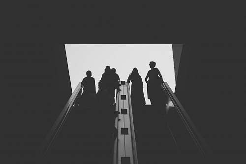 black-and-white silhouette photo of person grey