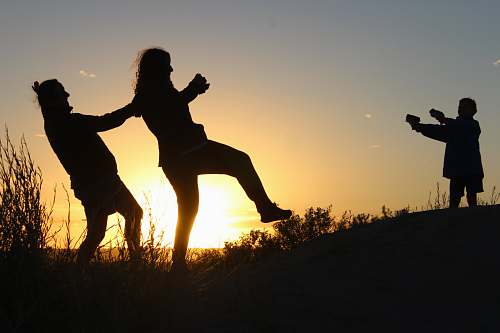 human silhouette photo of three person person