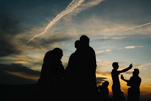 human silhouette photography of people under sky person