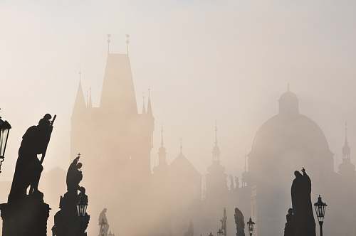 grey silhouette photography of statues \ prague