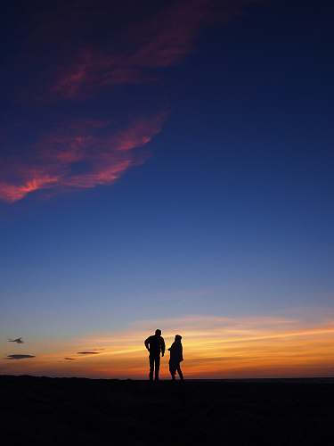 human silhouette photography of two persons standing person