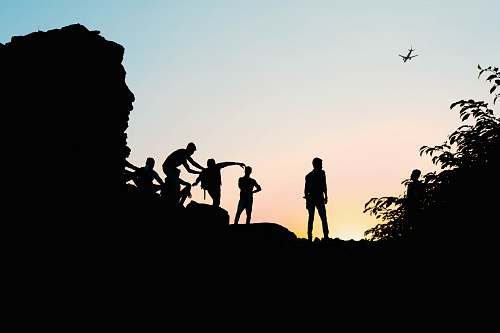 person silhouette view of men on the hill human
