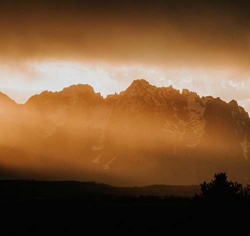 sunset snow-covered mountains sky