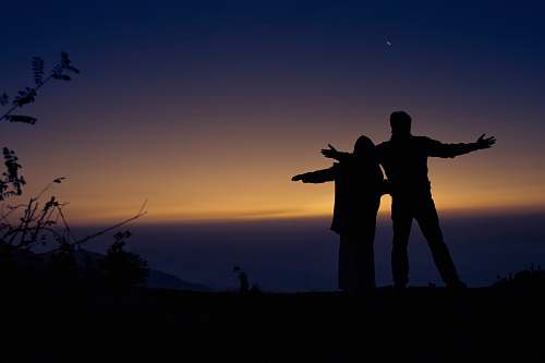 person two silhouette of person standing outdoor during nighttime human