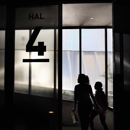 human two woman walking through door people