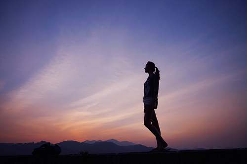 person woman standing under blue sky people