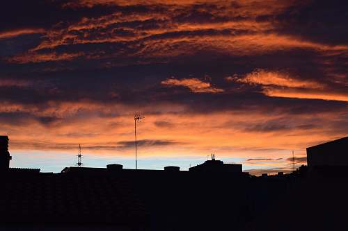 sunrise silhouette of buildings under golden hour sunset