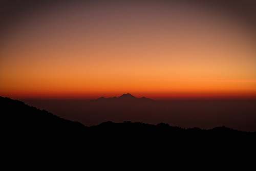 sunrise silhouette photography of mountains during sunset sunset