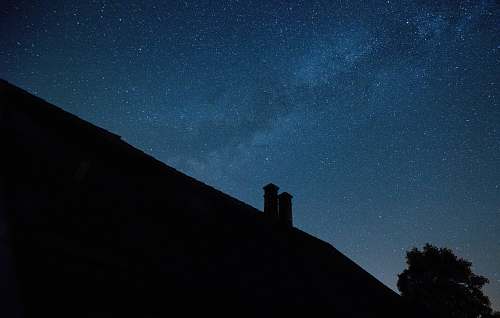 grey silhouette photography of roof house night