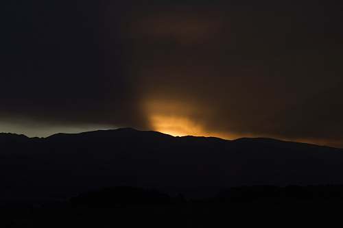sunset silhouette of mountain during sunset nature