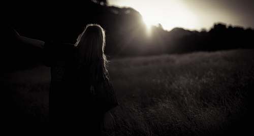 girl woman walking on grass field field