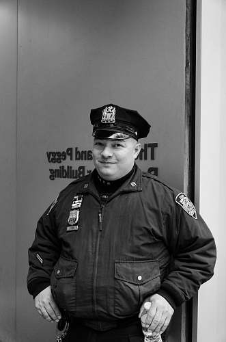 human grayscale photography of police man people