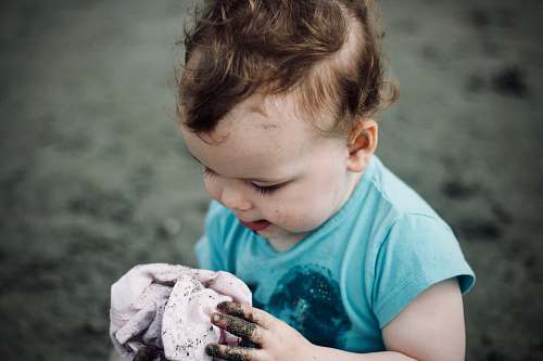 people baby holding a cloth person