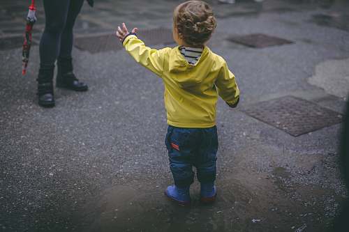 people boy wearing yellow hoodie person