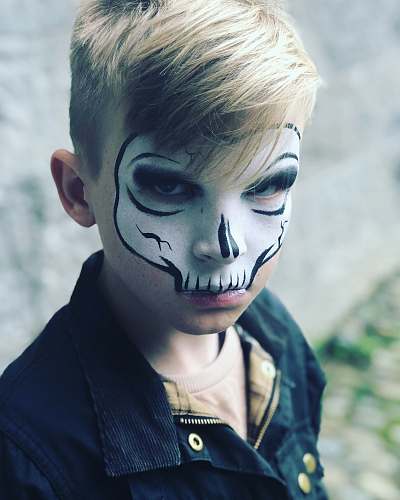 person child with skull face painting people