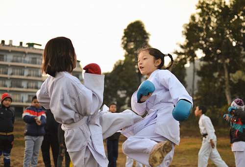 people children participating in martial art sparring person