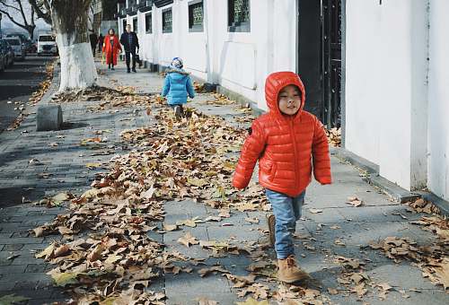 people children walking beside street person