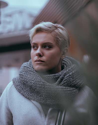people close-up photo of woman in gray scarf person