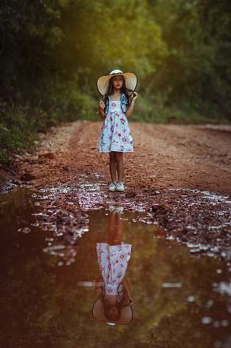 people girl standing in front body of water person