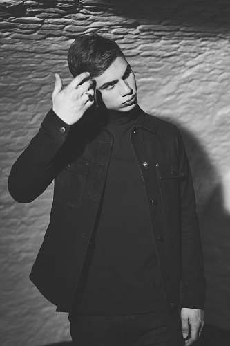 people grayscale photo of man dress shirt black-and-white