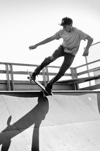 person grayscale photo of man on skateboard black-and-white