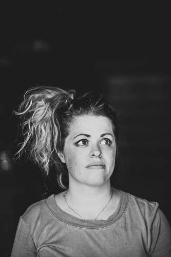 person grayscale photo of woman wearing scoop-neck top black-and-white
